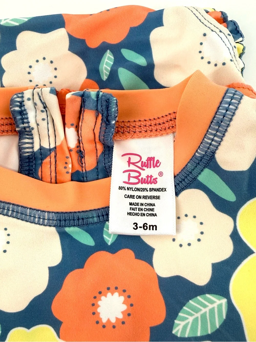 Ruffle Butts Baby Girls Peach, Yellow and Blue Floral One-Pc  Swimsuit Rashguard